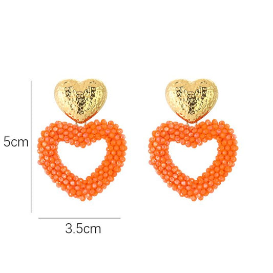 Kralen oorbellen hart oranje