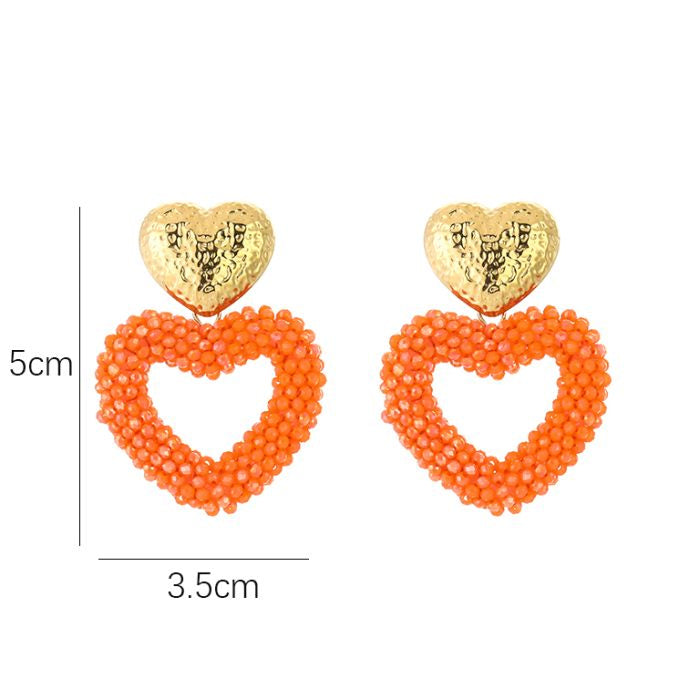 Kralen oorbellen hart oranje